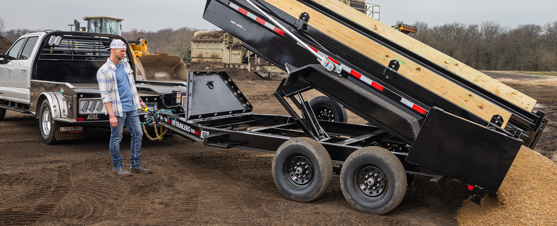 PJ Trailer dump trailer unloading gravel.