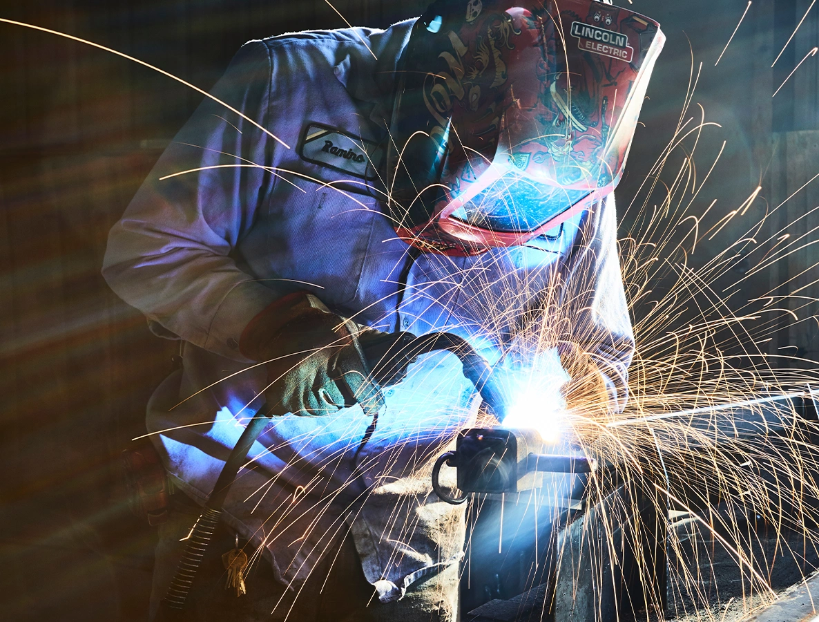 Welder working on a trailer.